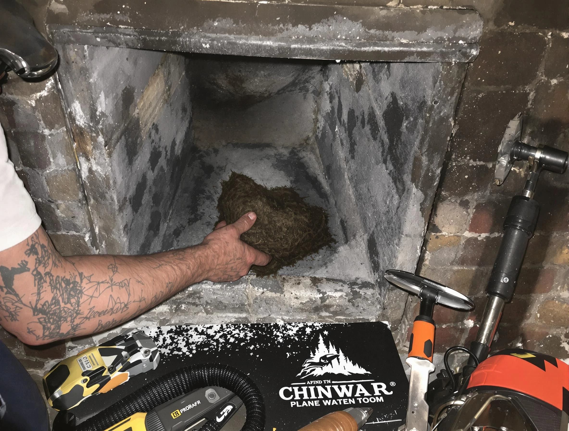 Stone Mountain Chimney Sweep safely removing debris and screening chimney in Stone Mountain, GA